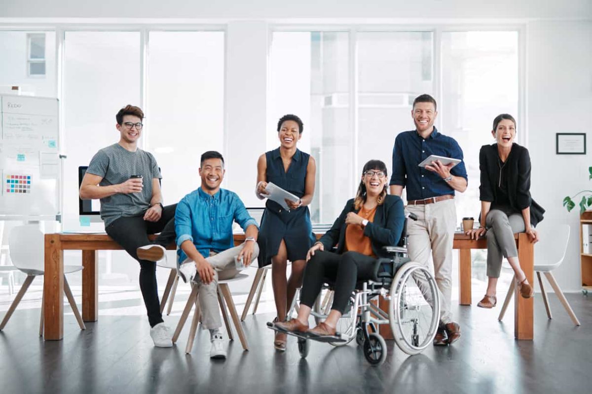 Group of coworkers together, with one in a wheelchair